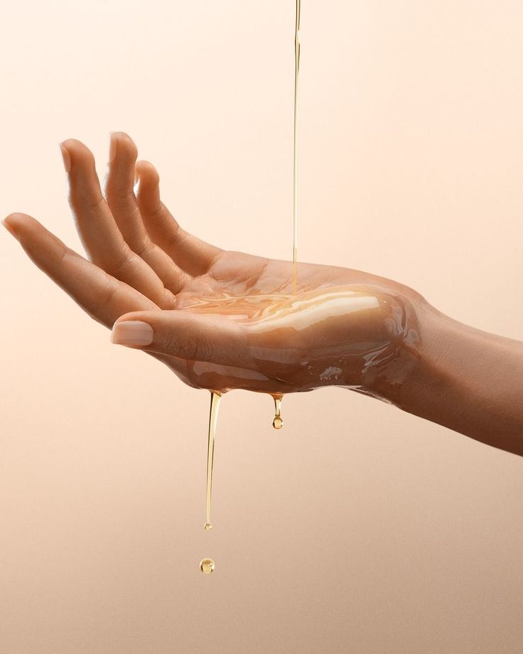 Veloura final product image with hand and dropper detail